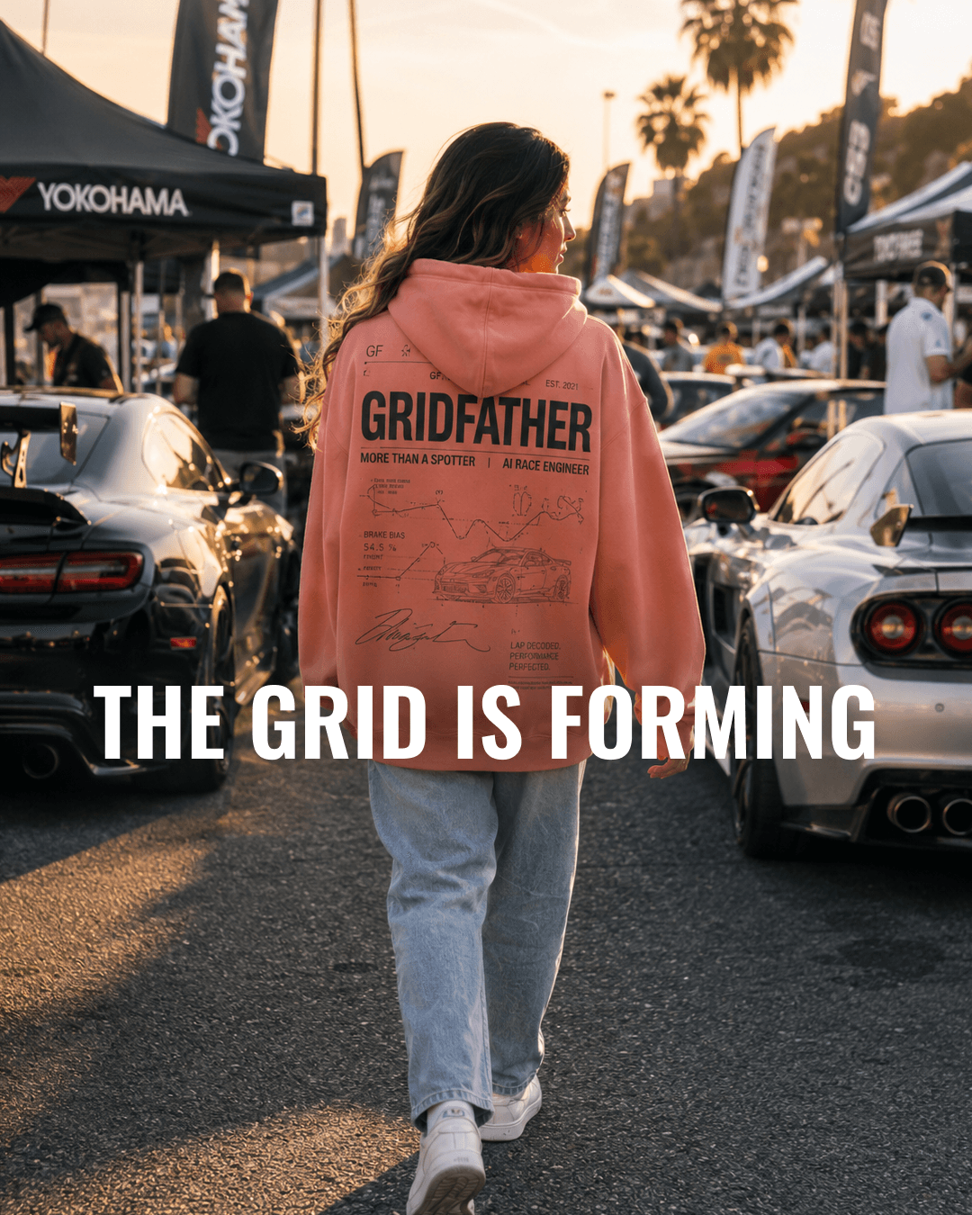 GridFather hoodie at a sim racing paddock with the text The Grid Is Forming